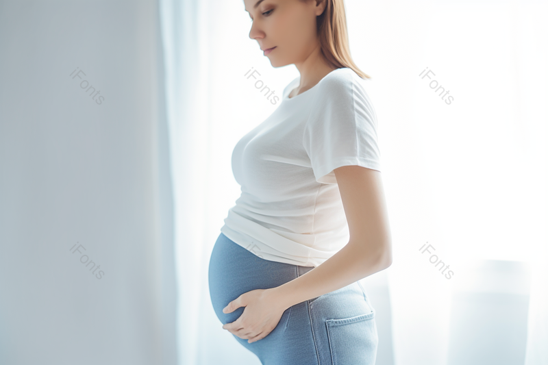 年轻女人手扶肚子的孕妇近距离镜头,高清,摄影图,摄影图片,图片大全,摄影图免费下载